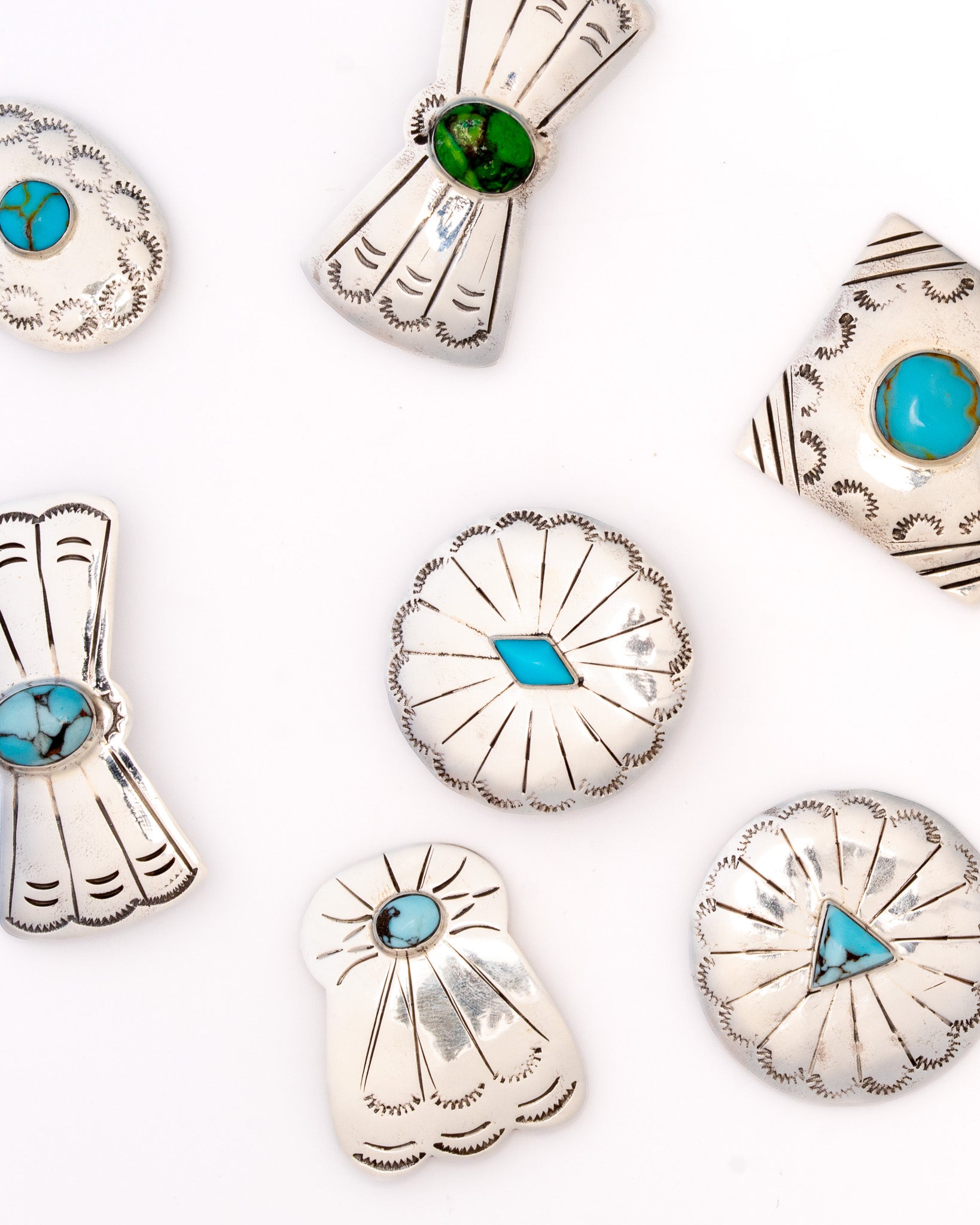 A range of Gather Goods bolo faces in sterling silver and turquoise, each one hand stamped and slightly different